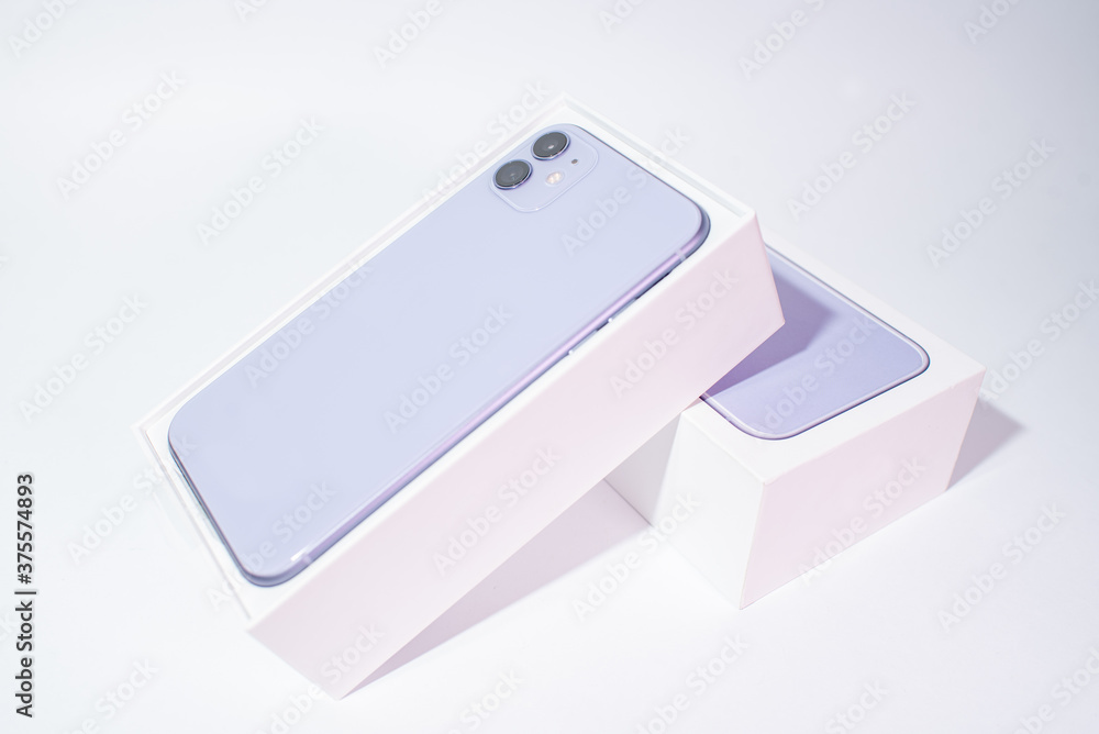 Purple smartphone with two cameras on a white background Purple smartphone with two cameras on a white background