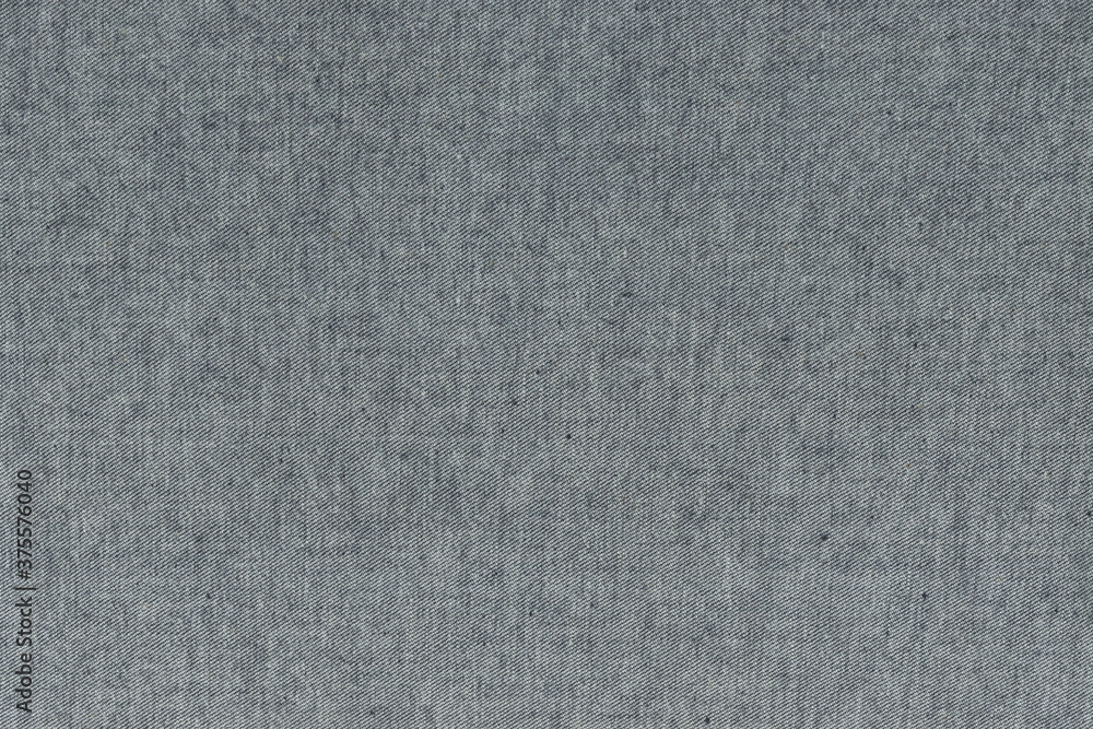 The texture of the wrong denim fabric. Rough natural grey fabric. The texture of the wrong denim fabric. Rough natural grey fabric.