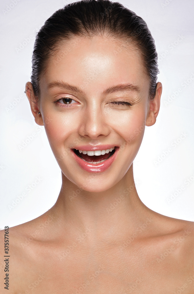 Beautiful young girl with a light natural make-up and perfect skin. Beauty face. Beautiful young girl with a light natural make-up and perfect skin. Beauty face.