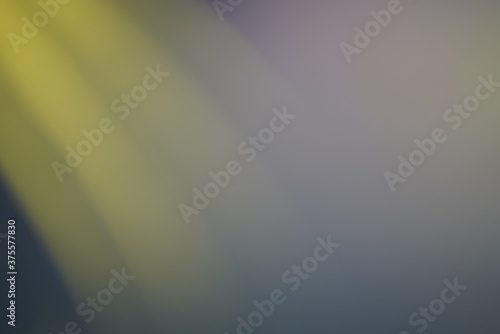 Blurred photo for gradient pattern yellow line as sun lighting shade on blue screen background. 