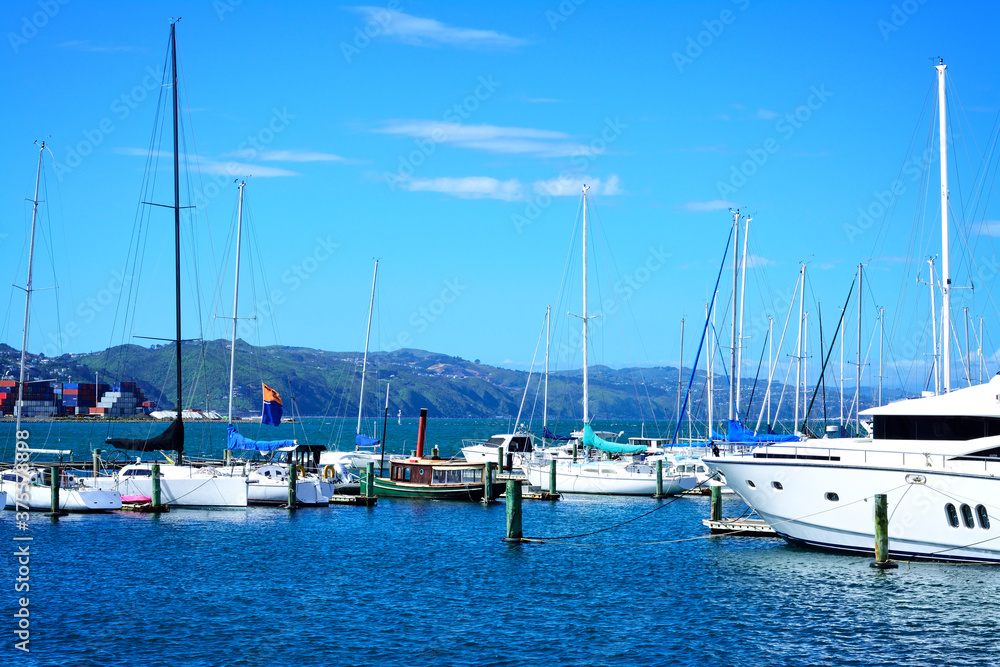 Sailing boats anchored at city centre marina in Wellington, New Zealand. Selective focus