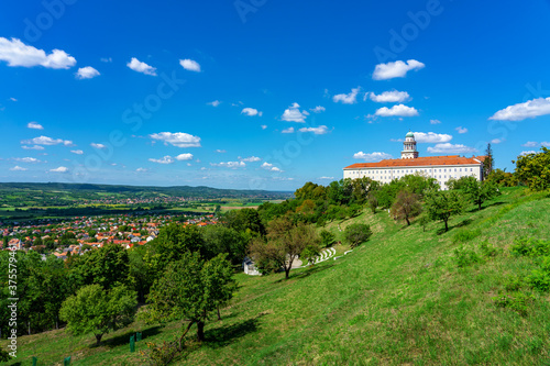 Pannonhalma abbey on the hill with view of the city and nature photo