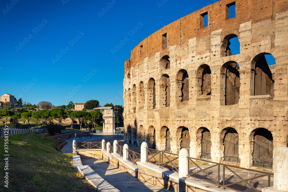 Fototapeta premium The Colosseum in Rome at sunrise, Italy