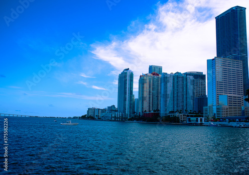 View of buildings next to the Miami South Channel in Brickell Miami  Florida during the day time  Skyline of Brickell near the the Miami South Channel with blue sky  Nice day in Brickell Miami  City