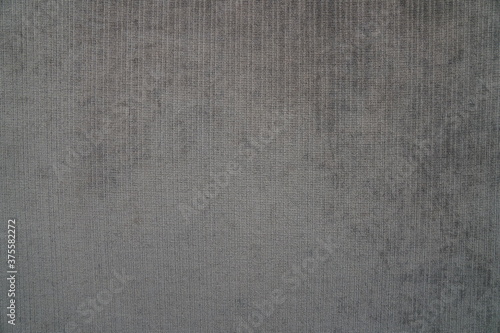 Close-up of texture on fabric dark gray abstract background.