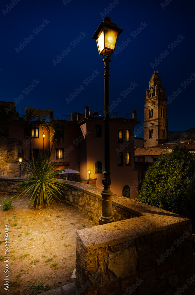Gaeta Italy. The historic center of the city with a look to the Bell Tower of the Cathedral of Santa Maria at night with street lights.