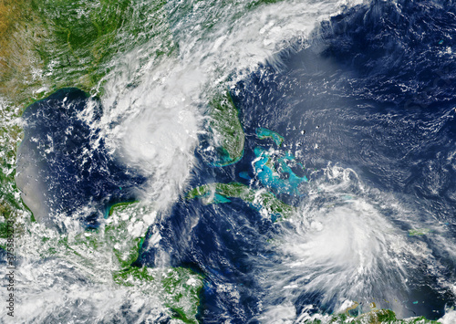 Fototapeta Naklejka Na Ścianę i Meble -  Laura and Marco storms are approaching USA, view of two tropical hurricanes from space. Elements of this image furnished by NASA.
