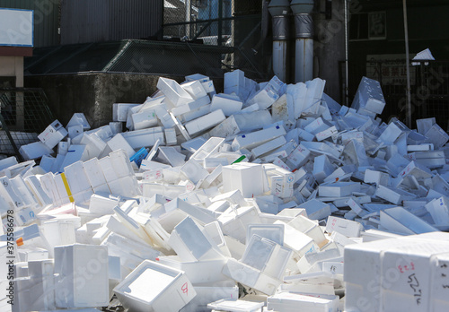 Discarded polystyrene ice boxes in the Tsukiji fish market in Tokyo, the world's wholesale fish and seafood market. photo