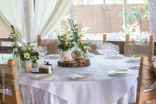  A fragment of a rustic banquet table decor for a romantic atmosphere.