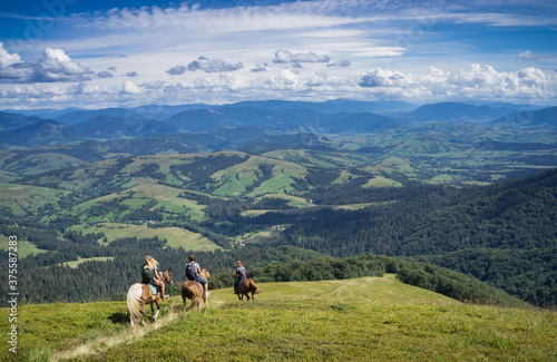 Horseback riding in the Carpathian mountains. © baxys