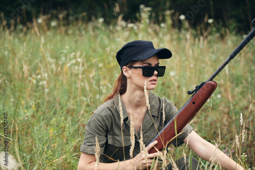 Woman soldier Sunglasses with arms in shelter weapons 