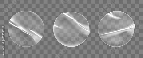 Transparent round adhesive stickers mock up set isolated on transparent background. Plastic crumpled round sticky label with glued effect. Template of a label or price tags. 3d realistic vector mockup