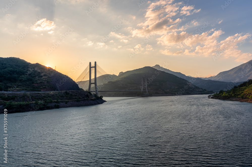 Obraz premium Sunset at the Barrios de Luna reservoir with views of the cable-stayed bridge, Leon (Spain)
