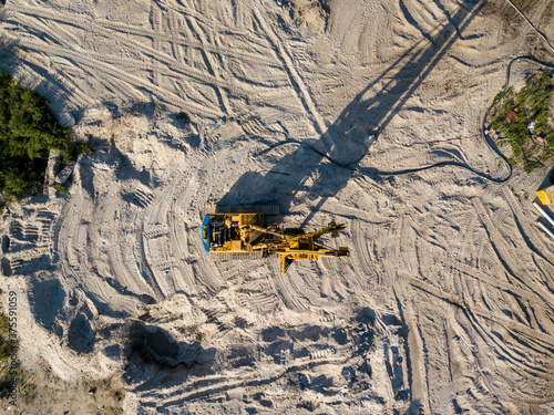 Aerial drone view. Drilling machine on a bridge construction site.