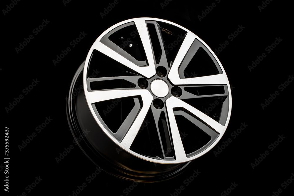 new alloy wheels on a black background. stylish and beautiful. auto parts and auto tuning