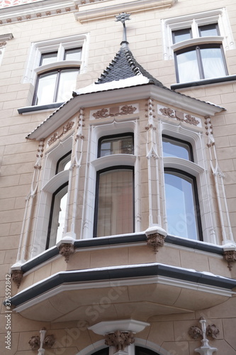 Building (detail) on Amatu street, 4 in Riga city, Latvia, Europe. Old architecture. Neo-Gothic style, 1903. Riga City Council's City Development Department. Riga sight photo