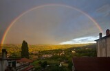 integral rainbow over the village in the arezzo country, on summer sunset, tuscany, italy