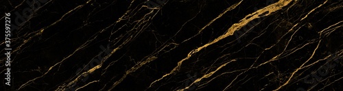 black marble background with yellow veins © Obsessively