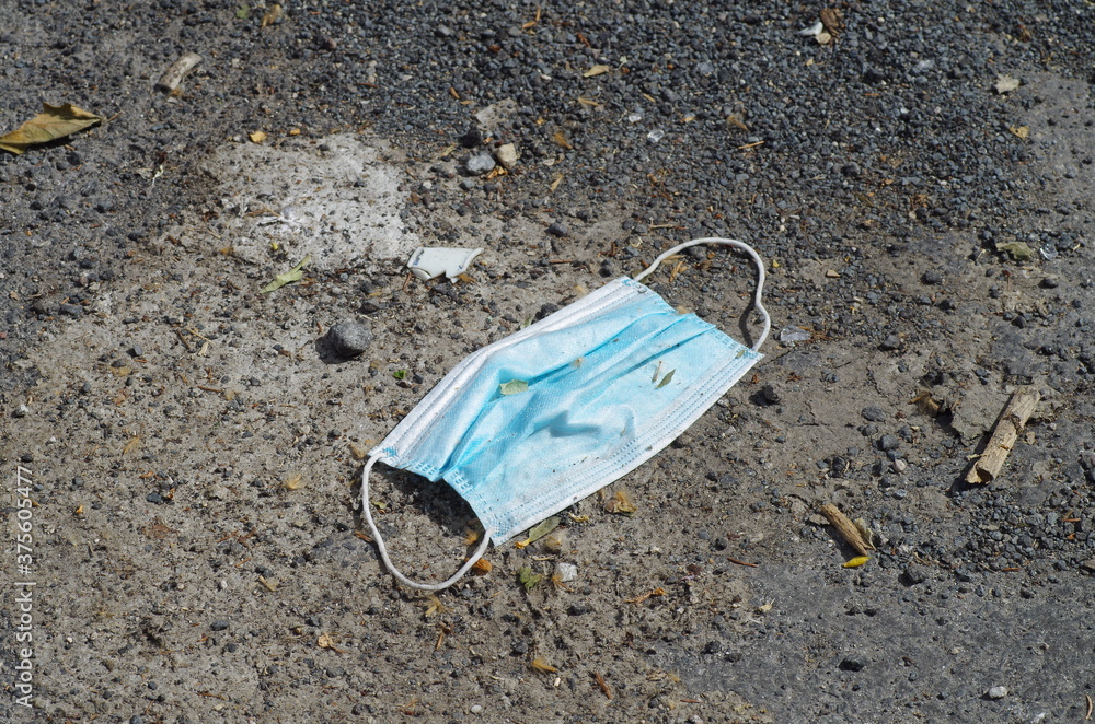 covid-19 mask .left on the ground covid-19 mask .left on the ground