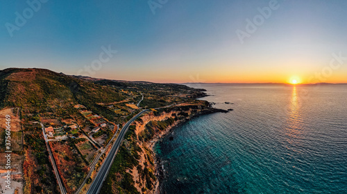 Magical aerial drone view of coastline at sunset in Sardinia, Italy