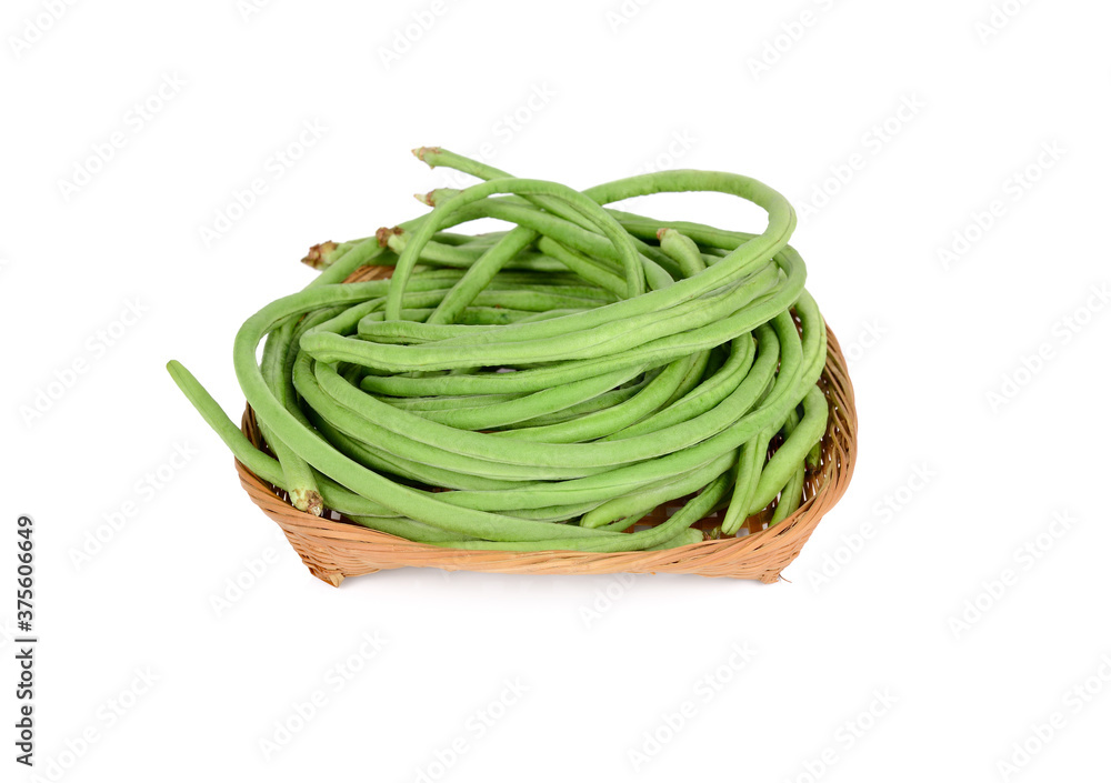 uncooked fresh yard long bean in basket on white background