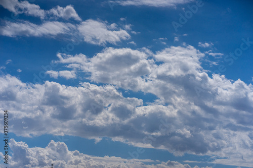 Blue cloudy sky. Background for PC and laptop. Sky replacement for other photos.