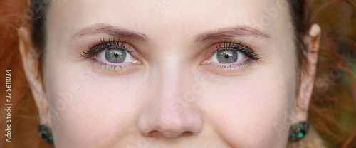 Obraz na płótnie Woman with green color eye iris close up