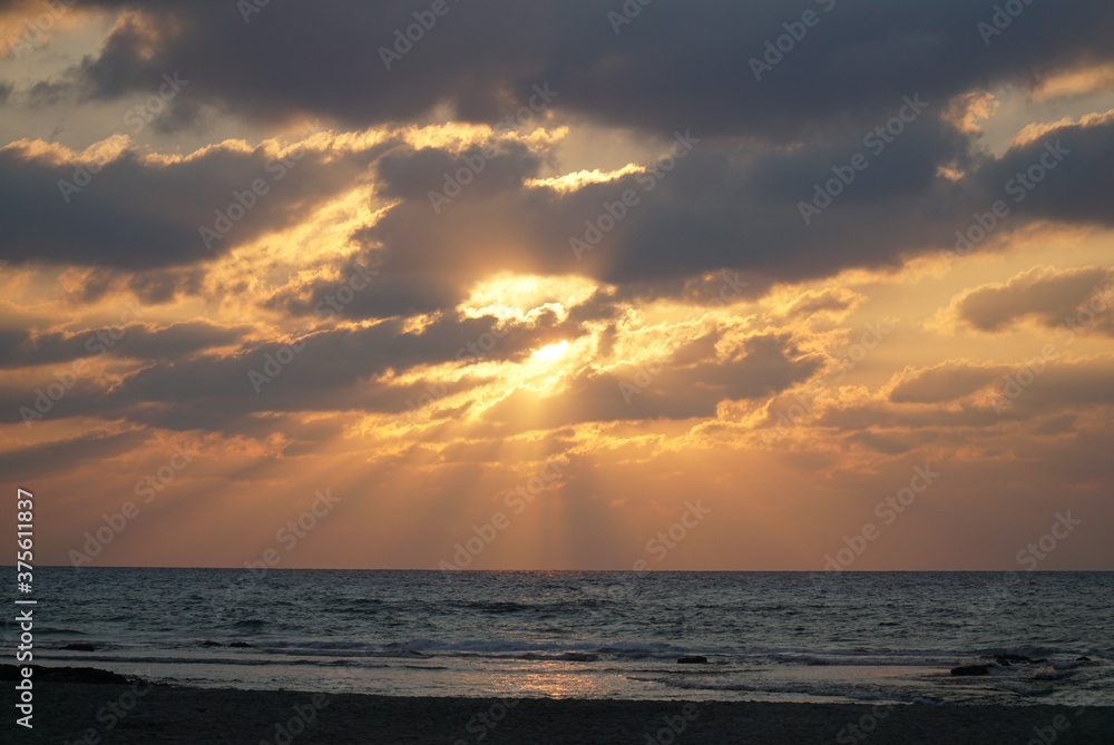 Golden summer sunset over the Mediterranean Sea, HaBonim Beach, Israel
