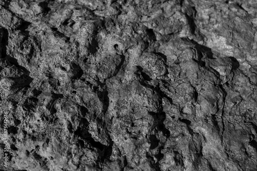 Closeup on rock rough natural mineral stone background, top view. Closeup on rock rough natural mineral stone background, top view.