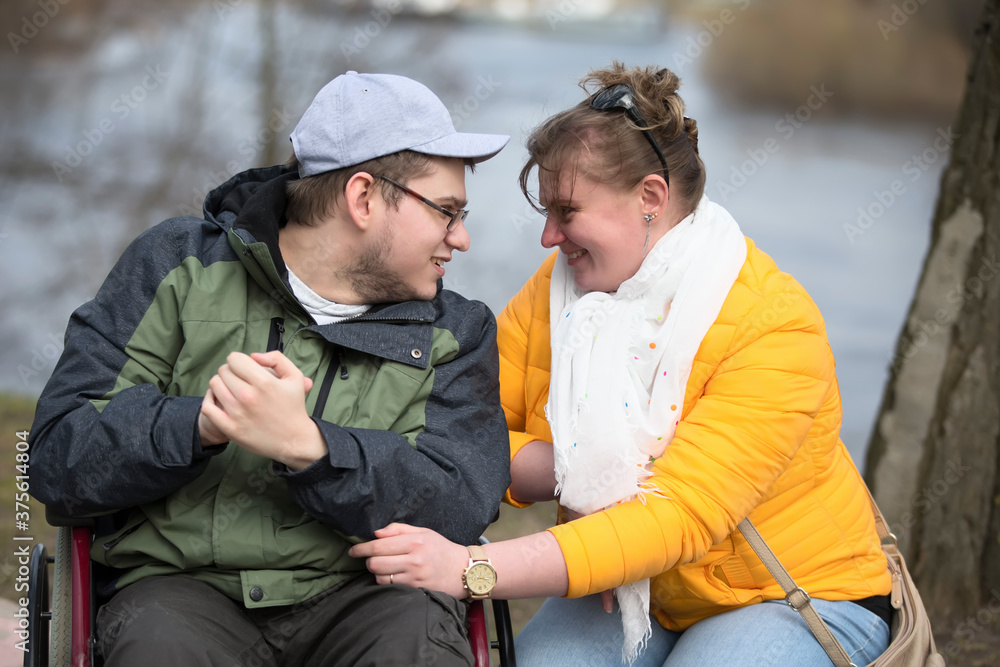 A man in a wheelchair with his family