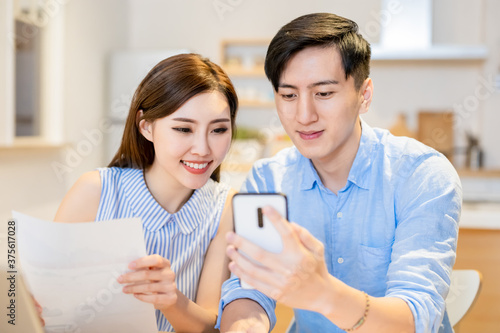 couple discuss finances at home