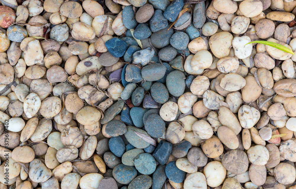 Sea pebbles. Small stones gravel texture background.Pile of pebble. Color stone in background. Sea pebbles. Small stones gravel texture background.Pile of pebble. Color stone in background.