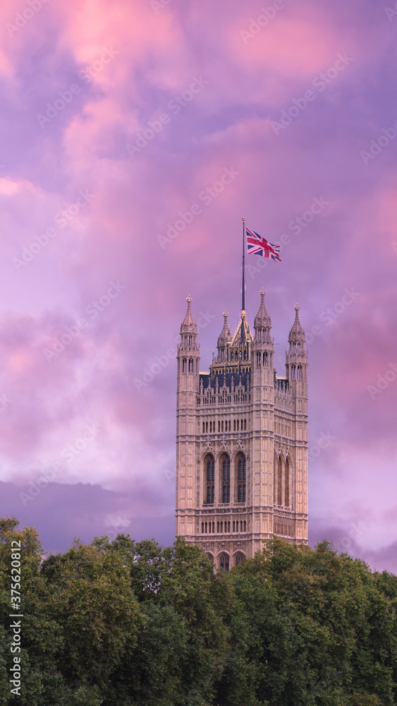 Houses of parliament at sunset with union jack flag London england uk Houses of parliament at sunset with union jack flag London england uk