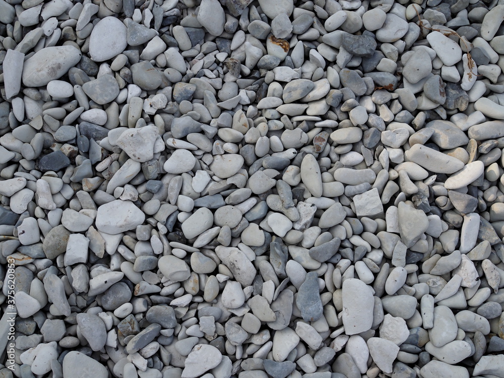 abstract background with round peeble stones on sunny day abstract background with round peeble stones on sunny day