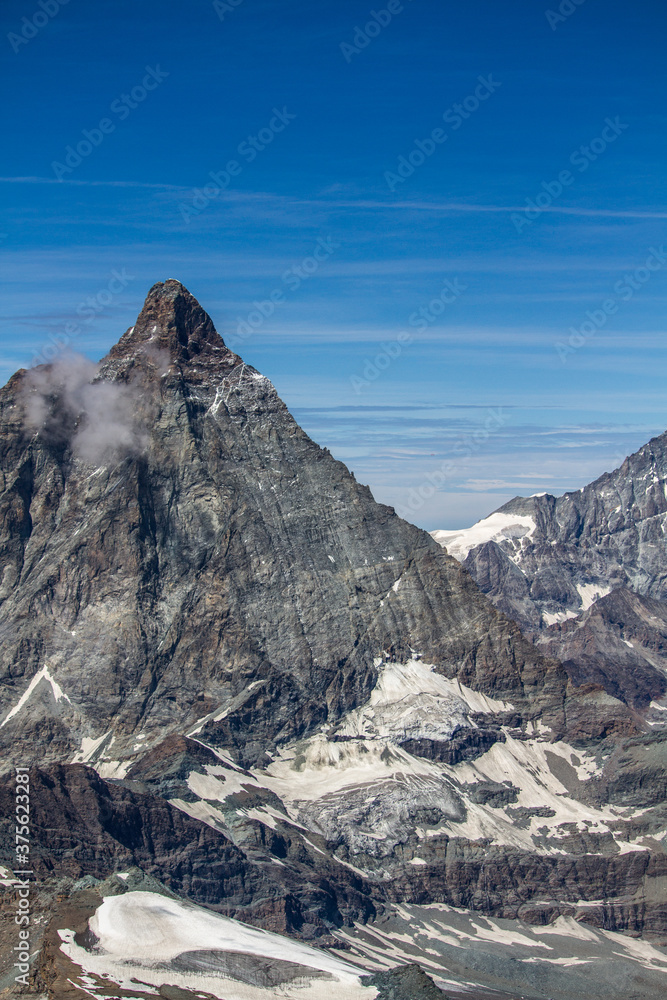 Vertical view of Matterhorn mountain eastern wall with glaciers (summer)