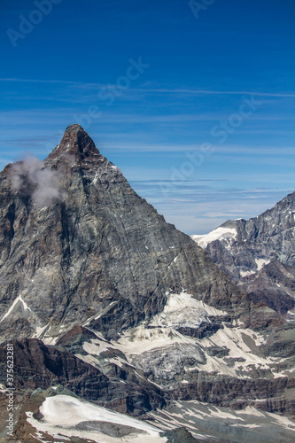Vertical view of Matterhorn mountain eastern wall with glaciers (summer)