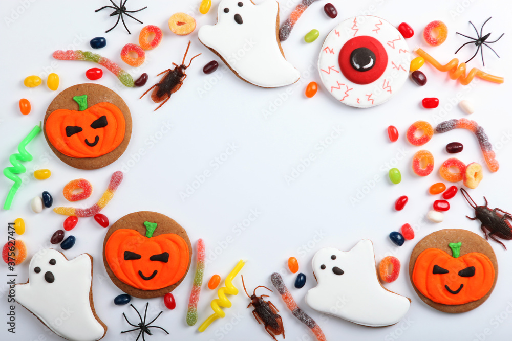 Halloween background with gingerbread and other sweets top view with place for text Halloween background with gingerbread and other sweets top view with place for text