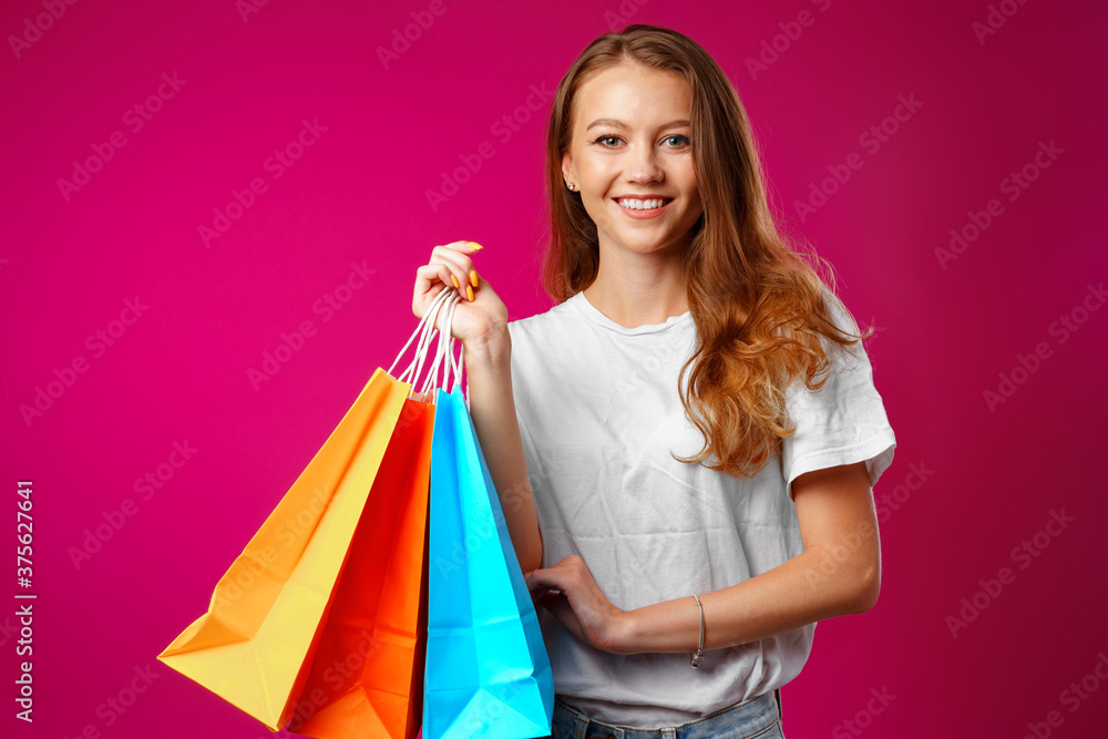 Portrait of happy young smiling woman with shopping bags Portrait of happy young smiling woman with shopping bags
