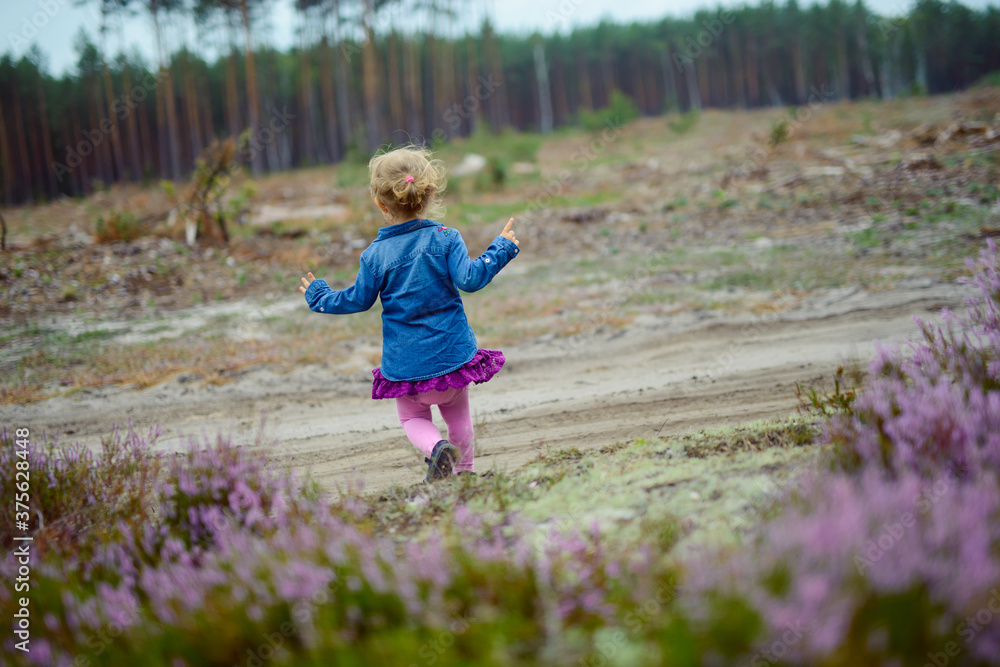 Adorable girl having fun on beautiful autumn day. authentic childhood image. Adorable girl having fun on beautiful autumn day. authentic childhood image.