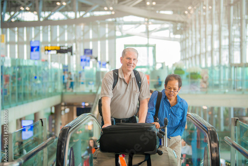 Senior couple traveler with suitcases at the airport. Lover travel