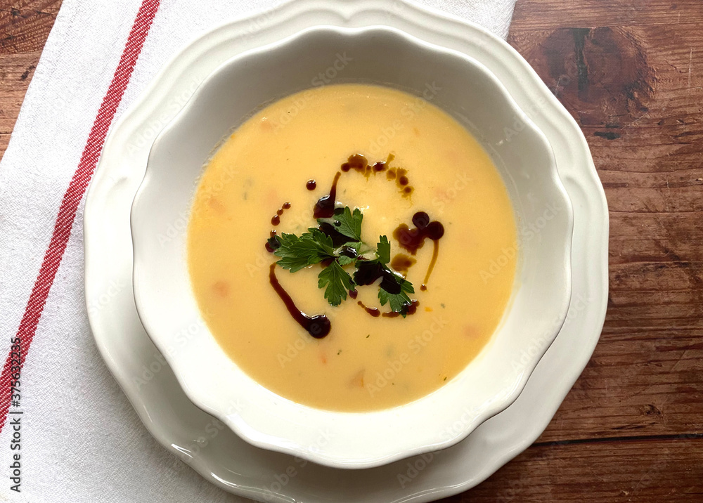 Creamy pumpkin soup with pumpkin pieces and a few drops of pumpkin seed oil. Creamy pumpkin soup with pumpkin pieces and a few drops of pumpkin seed oil.