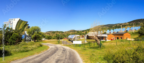 Odeillo solar furnace, France, the world largest solar furnace. Mirrors on a hillside reflect sunlight into the 54 meter high parabolic mirror 