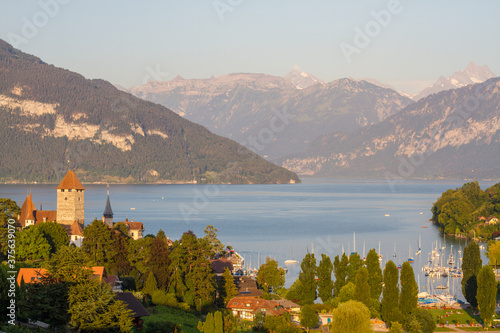Lake view of village Spiez with castle and mountains at Lake Thun (Thuner See), Switzerland