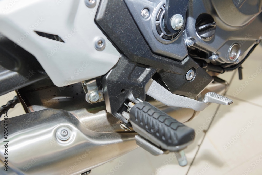 The master performs maintenance on the motorcycle. The master performs maintenance on the motorcycle.
