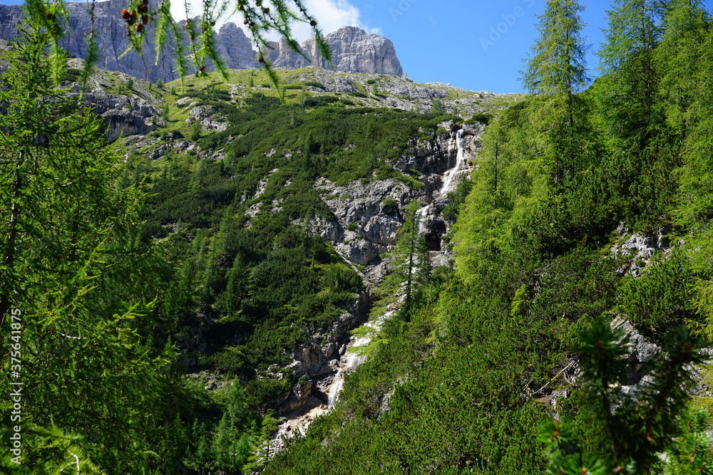 Hidden waterfall on italian alps during an hiking day from Val Fiscalina to Three Peaks of Lavaredo, Sudtirol, Trentino Alto Adige, Dolomites, Unesco, Italy