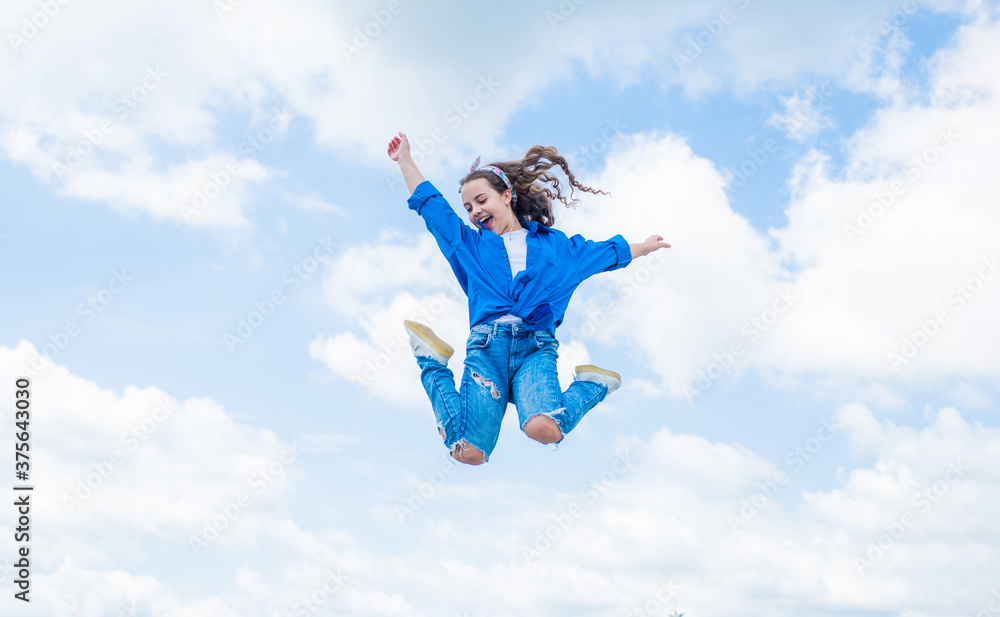free your imagination. kid beauty and fashion. child jump in casual style. Child jumping on background of sky. summer holiday concept. childhood happiness. happy childrens day. Beautiful female free your imagination. kid beauty and fashion. child jump in casual style. Child jumping on background of sky. summer holiday concept. childhood happiness. happy childrens day. Beautiful female