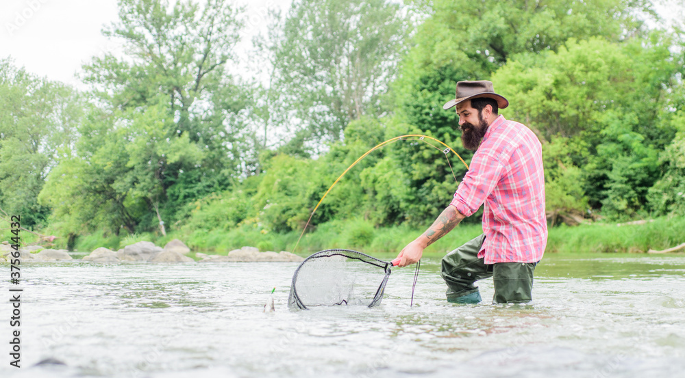 new skills. hobby and sport activity. Happy bearded fisher in water. fisherman show fishing technique use rod. mature man fly fishing. man catching fish. summer weekend. Fly fishing new skills. hobby and sport activity. Happy bearded fisher in water. fisherman show fishing technique use rod. mature man fly fishing. man catching fish. summer weekend. Fly fishing