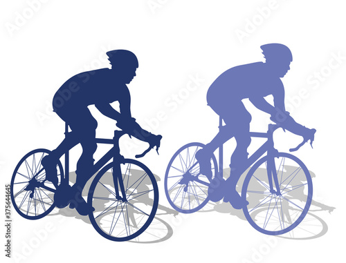 Race cyclists riding their bikes on the road