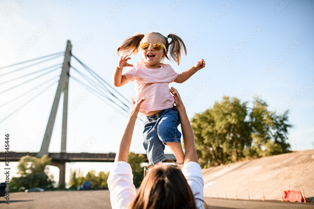handsome little girl who is thrown up by her mother handsome little girl who is thrown up by her mother