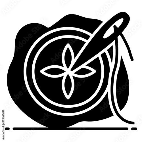 
Needle with thread on a piece of cloth, icon of needle work
